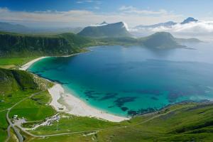 an aerial view of a beach and the ocean at Lofoten Cruise & Hotel in Svolvær