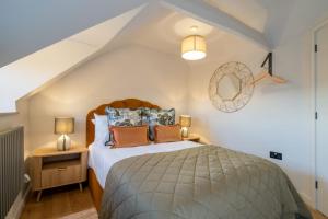Postel nebo postele na pokoji v ubytování Olive Cottage