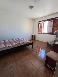 Ένα ή περισσότερα κρεβάτια σε δωμάτιο στο Empresas e viajantes com quartos mobiliados temporada