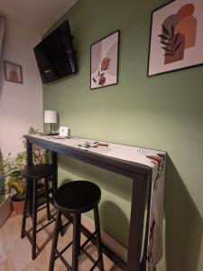 Μια τηλεόραση ή/και κέντρο ψυχαγωγίας στο Le Taverne Appartement +29 φωτογραφίες