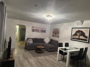 a living room with a couch and a table at Dream Flat in Bristol