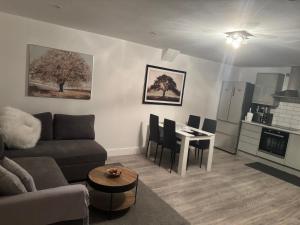 a living room with a couch and a table at Dream Flat in Bristol