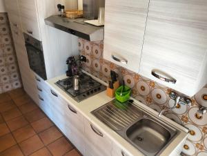 Η κουζίνα ή μικρή κουζίνα στο Da Jack Rooms, la tua casa vacanze!