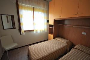 Ένα ή περισσότερα κρεβάτια σε δωμάτιο στο Villette Allodola