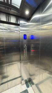 a elevator in a building with a metal door at Comfort meets convenience 3BR by Airport & SGR in Nairobi