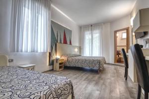 Postel nebo postele na pokoji v ubytování Hotel Riz + 27 fotografií