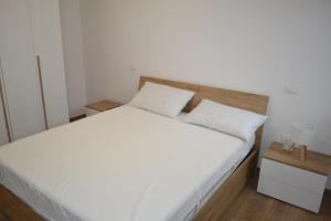 Giường trong phòng chung tại Nido Gran Sasso