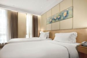 Ліжко або ліжка в номері Eco Tree Hotel Sheung Wan