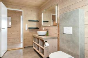 a bathroom with a sink and a toilet at Modern Mountain Cabin Near Norefjell in Eggedal +32 photos
