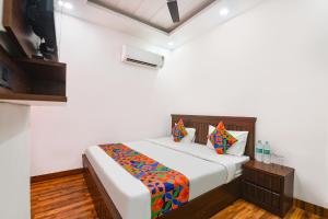 Ένα ή περισσότερα κρεβάτια σε δωμάτιο στο FabHotel The Dream Inn +13 φωτογραφίες