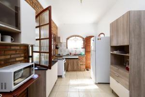 Køkken eller tekøkken på Village Itaúna Inn - Casas de Temporada