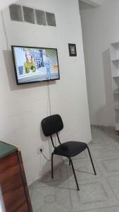 Et tv og/eller underholdning på Suítes Da Lady