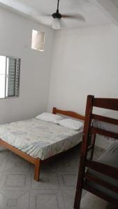 En eller flere senge i et værelse på Suítes Da Lady