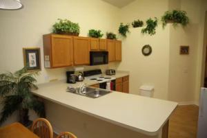 a kitchen with a sink and a counter top at Lake Berkley 5 bedrm 3 bath villa near Disneyland in Kissimmee