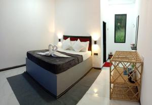 Postel nebo postele na pokoji v ubytování Ravan Pine Nature Retreat