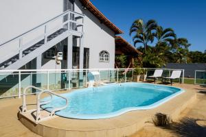 Swimmingpoolen hos eller tæt på Village Itaúna Inn - Casas de Temporada