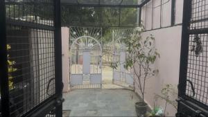 an open door to a building with a gate at Pilgrim Abode Teerth Yatriyon ka Thikana in Jāmb