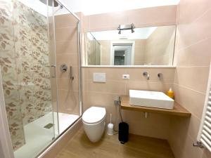 a bathroom with a shower and a toilet and a sink at A casa di Adele in Taormina +36 photos