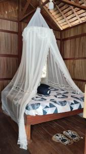 Ένα ή περισσότερα κρεβάτια σε δωμάτιο στο Frits Homestay +17 φωτογραφίες