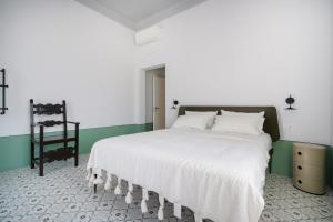 Giường trong phòng chung tại Villa Capobianco