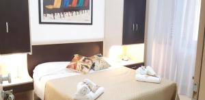 Postel nebo postele na pokoji v ubytování Sirina House Taormina + 4 fotografie