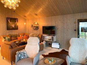 TV a/nebo společenská místnost v ubytování Moderne Hytte Tæt Ved Skiløjperne I Haglebu