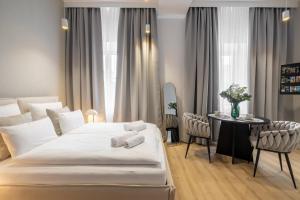 Ένα ή περισσότερα κρεβάτια σε δωμάτιο στο VIP Apartamenty BAST 143 TOP LOCATION - LUX z WANNĄ OFF Piotrkowska Stajnia Jednorożca HopaLupa ATLAS ARENA