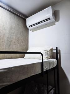 Ένα ή περισσότερα κρεβάτια σε δωμάτιο στο High Floor sea view 12 pax 3BR luxury suites b29 +18 φωτογραφίες