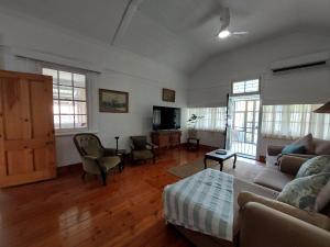 a living room with a couch and a table at Coda in Umkomaas