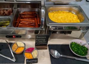 a buffet of food with eggs and other foods at HOLA GDYNIA in Gdynia