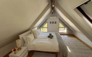 En eller flere senge i et værelse på Arkelshoek Cottages