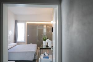 Ένα ή περισσότερα κρεβάτια σε δωμάτιο στο Pepenero Apulian Rooms +4 φωτογραφίες