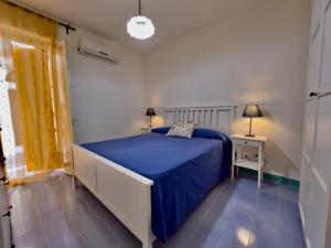 En eller flere senge i et værelse på Casa di Rosa - 500m from the beach