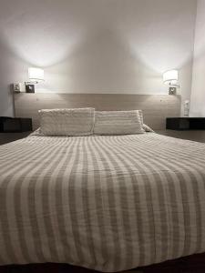 Ένα ή περισσότερα κρεβάτια σε δωμάτιο στο Alquiler en San Rafael +6 φωτογραφίες