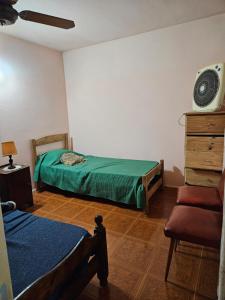 Postel nebo postele na pokoji v ubytování El gran descanso