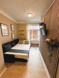 Ένα ή περισσότερα κρεβάτια σε δωμάτιο στο Lillehammer Camping - Sentrums leilighet +32 φωτογραφίες