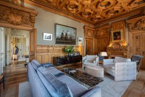a living room with a couch and chairs and a table at Verride Palácio Santa Catarina in Lisbon