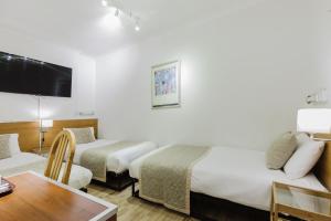 TV a/nebo společenská místnost v ubytování The Chapter Hotels - Falcon Hotel + 34 fotografií