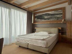 Postel nebo postele na pokoji v ubytování Liz Hotel & Apartments