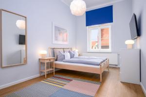 Giường trong phòng chung tại Stadtapartments Greifswald