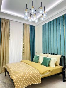 Postel nebo postele na pokoji v ubytování Modern Stroy 40 by Royal Rentals