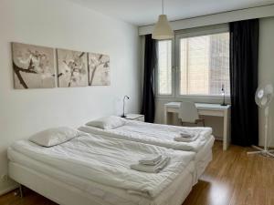 Ένα ή περισσότερα κρεβάτια σε δωμάτιο στο Downtown apartment for 4 - Kotimaailma