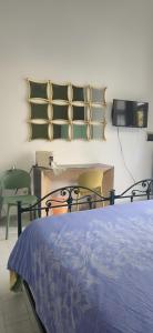 Ένα ή περισσότερα κρεβάτια σε δωμάτιο στο Monolocale Carafa