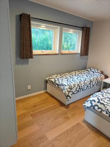 Ένα ή περισσότερα κρεβάτια σε δωμάτιο στο Guesthouse Gävle - close to E4 & nature recreation area