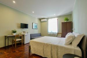Giường trong phòng chung tại Domus Fabia - Rooms & Apartments