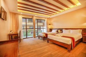 Ένα ή περισσότερα κρεβάτια σε δωμάτιο στο Royal Jungle Villas