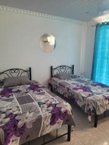 Ένα ή περισσότερα κρεβάτια σε δωμάτιο στο PEREYBER BUNGALOW No 3