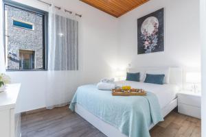 Postel nebo postele na pokoji v ubytování Villa Magnolia by Atlantic Holiday