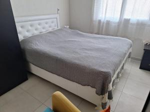 Postel nebo postele na pokoji v ubytování Sozer Apt