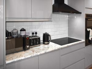 Kuchyň nebo kuchyňský kout v ubytování Cliffside Cottage